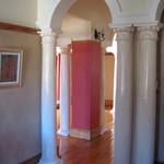 opened hallway that was previously dark:  Corridor & hallway by Nuclei Lifestyle Design