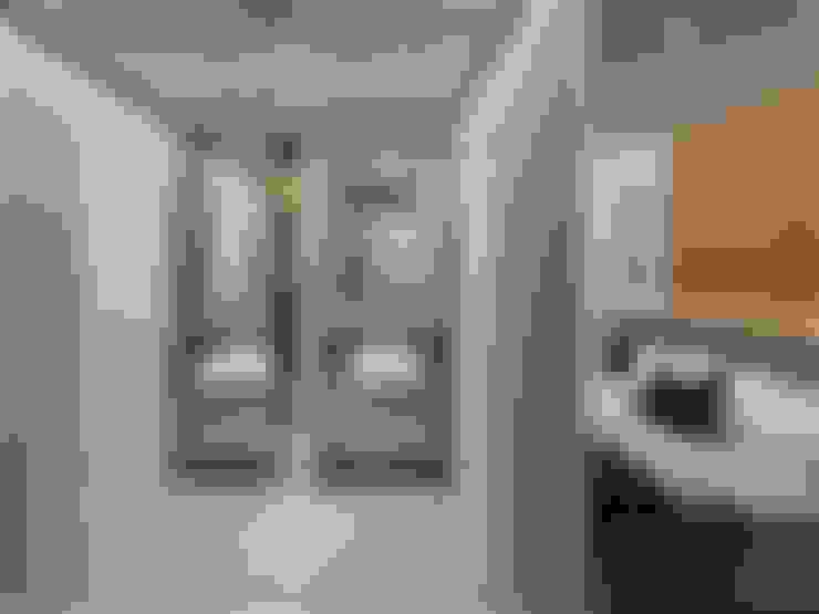 Banheiro integrado: Banheiros  por Vilaville 