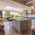 An open view of the High Peak John Gauld Photography Modern Mutfak Kitchen island,bifold doors