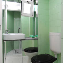 Casa de banho: Aproveitamento do vão da janela e do espaço anteriormente ocupado pela chaminé Casas de banho mediterrânicas por BL Design Arquitectura e Interiores Mediterrânico