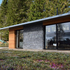 Stone / Timber cladding to living and dining Brown & Brown Architects Modern houses Wood modern,timber,stone,glass,house,rural,scotland,cairngorms,site,lowcost,sustainable,strathdon