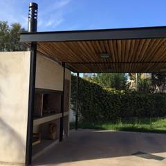 QUINCHO/GARAGE MPG: Casas de estilo  por Development Architectural group