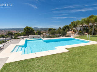 Piscina con pared de cristal, Gunitec Concept Pools Gunitec Concept Pools Jardínes: Ideas, imágenes y decoración