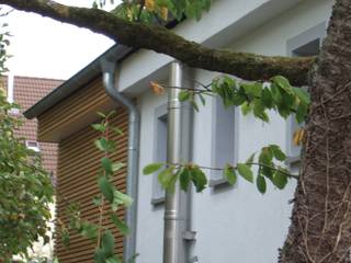 Siedlungshaus mit Holzscheibe, zymara und loitzenbauer architekten bda zymara und loitzenbauer architekten bda Maisons modernes