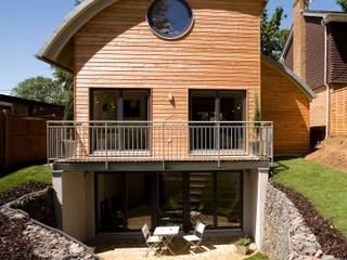 Timber Clad Passive House with Curved Roof, haus ltd haus ltd บ้านและที่อยู่อาศัย