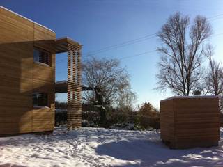 Un cube en bois, Tangentes Architectes Tangentes Architectes Casas de estilo moderno