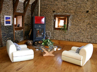 Barn in Chenailler Mascheix, France , Capra Architects Capra Architects Rustic style living room