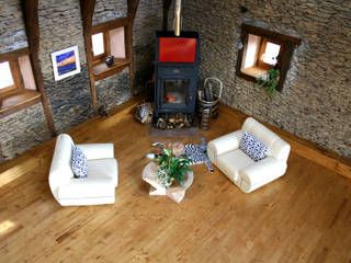 Barn in Chenailler Mascheix, France , Capra Architects Capra Architects Rustic style living room Lighting