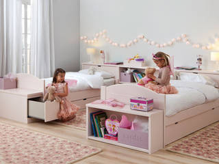 Habitación con dos camas nido decorada en rosa Sofás Camas Cruces Habitaciones para niñas
