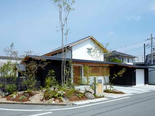 ウッドデッキで繋がる空間｜趣味を楽しむ住まい 姫路の家, 小笠原建築研究室 小笠原建築研究室 Casas unifamilares Madera Acabado en madera