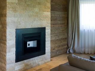 Living with travertine fireplace, Pietre di Rapolano Pietre di Rapolano Rustic style living room Stone