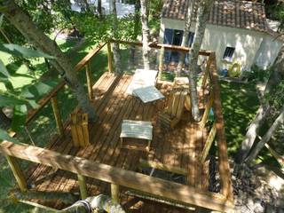 Une jolie petite terrasse a l'ombre des frênes, Cabaneo Cabaneo Jardines eclécticos