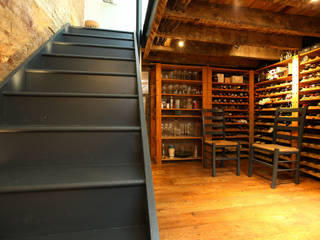 A beautiful place to store your bottles! PAD ARCHITECTS Wine cellar