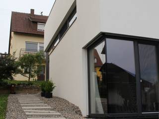 Raffiniertes Einfamilienhaus mit Pultdach, di architekturbüro di architekturbüro Casas de estilo minimalista