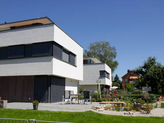 Ensemble von drei Einfamilienhäusern, Scholz&Fuchs Architekten Scholz&Fuchs Architekten Casas modernas
