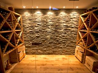 Chalet Les Chantéls: Un chalet neuf de luxe qui combine l'architecture traditionnelle savoyarde avec un intérieur contemporain, shep&kyles design shep&kyles design Wine cellar