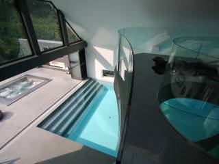 Indoor pool with waterfall features, sauna and stainless steel spa, Tanby Pools Tanby Pools Modern pool