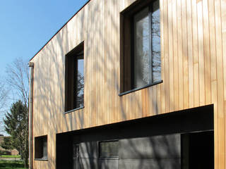 Maison au milieu des arbres, F. DEMAGNY ARCHITECTE F. DEMAGNY ARCHITECTE Casas modernas