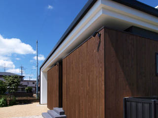 木板塀の家, Egawa Architectural Studio Egawa Architectural Studio Casas de estilo minimalista Madera Acabado en madera