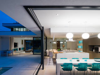 River House - Internal/external night view of dining room and kitchen Selencky///Parsons Dining room