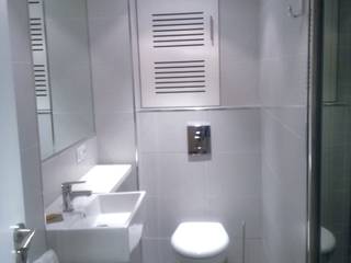 De aseo de cortesía a baño completo, Arquitectos Fin Arquitectos Fin حمام