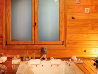 Otros interiores de Patagonia Log Homes, Patagonia Log Homes - Arquitectos - Neuquén Patagonia Log Homes - Arquitectos - Neuquén Bagno rurale Legno Effetto legno