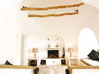 Complesso trulli. Valle d'Itria, Azzurra Garzone architetto Azzurra Garzone architetto Living room