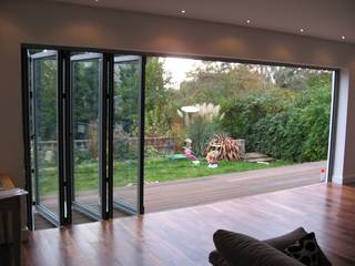 Folding glass doors homify Conservatory