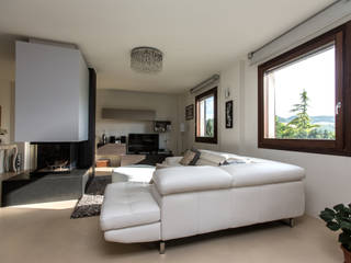 Open space in collina, QUADRASTUDIO QUADRASTUDIO Modern living room