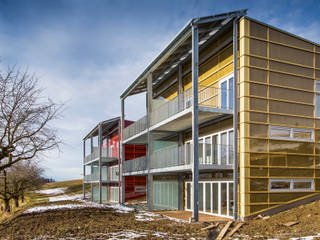 Plusenergieüberbauung in Englisberg, Swissrenova AG Swissrenova AG Modern Houses