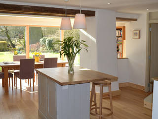 View from refurbished kitchen to garden room Hetreed Ross Architects Modern style kitchen