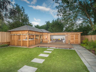 Bespoke garden building complete with spa and kitchen, Crown Pavilions Crown Pavilions Garajes de estilo moderno