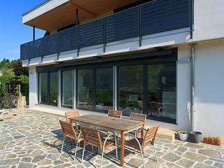 Haus Tessin, Holzhaus-Rosskopf Holzhaus-Rosskopf Klassischer Balkon, Veranda & Terrasse