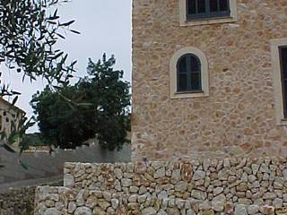 VIVIENDA, ABAD Y COTONER, S.L. ABAD Y COTONER, S.L. Rustic style houses Stone