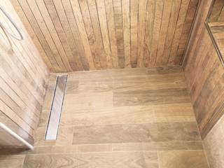 suelo de ducha in situ, con rejilla lineal Ahumada Construcciones y Rehabilitación S.L