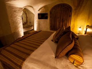 Emine Hanım evi Öncesi ve Sonrası, Kayakapi Premium Caves - Cappadocia Kayakapi Premium Caves - Cappadocia Rustikale Schlafzimmer