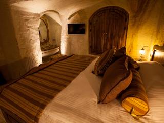 Emine Hanım evi Öncesi ve Sonrası, Kayakapi Premium Caves - Cappadocia Kayakapi Premium Caves - Cappadocia Camera da letto in stile rustico