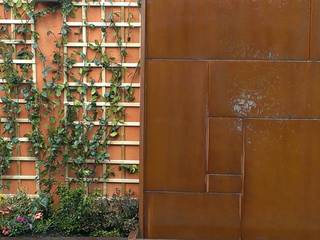 Un muro decorado con fuente de acero corten, El creador de paisajes El creador de paisajes حديقة