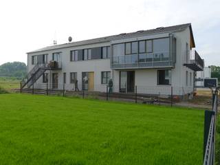 Dreifamilienhaus mit individuellen Wohnungen in Gelsenkirchen, puschmann architektur puschmann architektur Nhà phong cách đồng quê