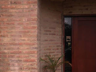 Casa en terrazas de la Estanzuela - La Calera - Cordoba - Argentina, Alejandro Asbert Arquitecto Alejandro Asbert Arquitecto Casas de estilo rústico Ladrillos