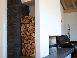 Kamin in Steinverkleidung , White Hills Stones GmbH White Hills Stones GmbH Modern living room Stone