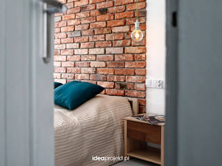 Cegły i piec kaflowy., idea projekt idea projekt Ausgefallene Schlafzimmer Ziegel Orange