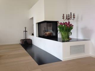 Moderner Eckkamin mit verlängertem Feuertisch, Christoph Lüpken Ofenbau GmbH - Kamine aus Duesseldorf Christoph Lüpken Ofenbau GmbH - Kamine aus Duesseldorf Modern living room