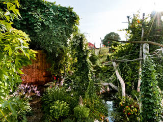 Idyllischer Naturgarten im Regenwaldstil , Gartenarchitekturbüro Timm Gartenarchitekturbüro Timm Сад в тропическом стиле