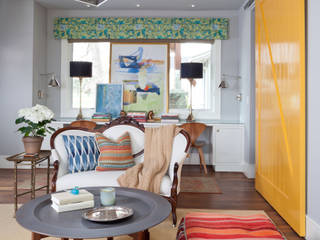 Elegant Modern and Timeless, Andrea Schumacher Interiors Andrea Schumacher Interiors Media room pendant light,abstract art,pouf,throw pillows,side table,table lamps,desk chairs,built in desk,Moroccan table,settee,mock roman valance,sliding barn door,articulating arm sconces,'