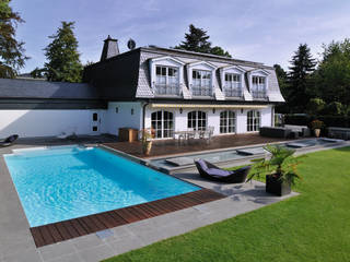 Mit dem besonderen Etwas - Ein Gartenpool mit Wasserlauf, Hesselbach GmbH Hesselbach GmbH مسبح