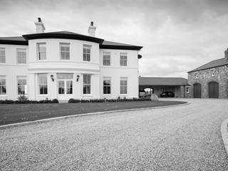 Set on a peninsula this home enjoys lake views to front and back as well as to new lake and walled garden adjacent to house, Des Ewing Residential Architects Des Ewing Residential Architects Classic style houses