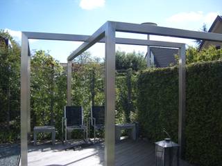 Moderne tuin met pergola van rvs, Joke Gerritsma Tuinontwerpen Joke Gerritsma Tuinontwerpen Jardines modernos