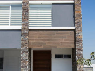 RESIDENCIA GACO, Excelencia en Diseño Excelencia en Diseño Minimalist house Stone