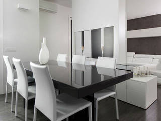 Interni di Design: Loft moderno arredato su misura con mobili realizzati dalla Falegnameria Semprelegno, Semprelegno Semprelegno Minimalist dining room